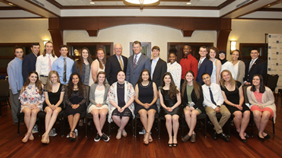 A group of scholarship recipients and CHS employees posing for the camera at an event